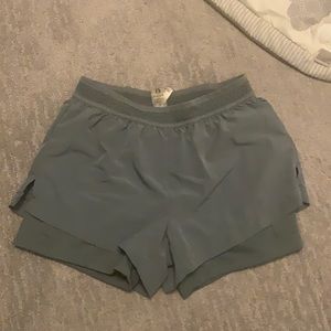 Green double layer athletic shorts